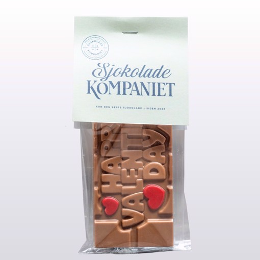 Bilde av Happy Valentine’s Day sjokoladeplate. En elegant sjokoladeplate laget av melkesjokolade og karamellsjokolade, preget med en romantisk hilsen, perfekt som gave til Valentinsdagen.