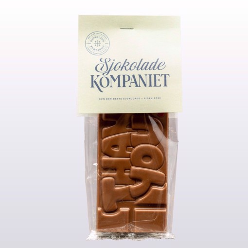 Bilde av "Thank You"-sjokoladeplate fra Sjokoladekompaniet, laget med fyldig melkesjokolade og søt karamellsjokolade. Sjokoladen har "Thank You" preget på overflaten, en elegant og smakfull gave for å vise takknemlighet.