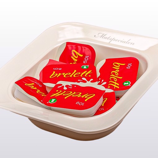 Bilde av margarin kuvert – små porsjonspakker med Brelett margarin, perfekt som smøremyk topping til brød og bakverk.