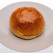 Bilde av nystekte Hveteboller med gyllen skorpe og luftig konsistens, perfekte til kaffepausen.
