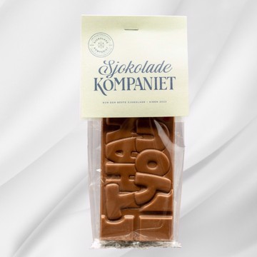 Bilde av Thank You! sjokoladeplate fra Sjokoladekompaniet, laget med fyldig melkesjokolade og søt karamellsjokolade. Sjokoladen har Thank You! preget på overflaten, en elegant og smakfull gave for å vise takknemlighet.