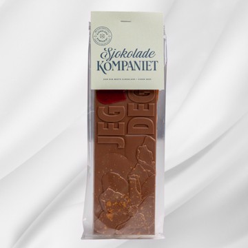 Bilde av en sjokoladeplate laget av melkesjokolade og karamellsjokolade, preget med teksten Jeg elsker deg! Platen ligger på en lys bakgrunn og formidler kjærlighet med en søt og personlig vri.